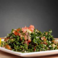 Tabouli (Vegan) · Chopped parsley, tomato, onion, lemon juice, cracked wheat, and olive oil.