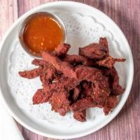 Beef Jerky · Deep-fried marinated beef sirloin served with chili sauce.