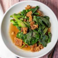 Chinese Broccoli With Crispy Pork / Kana Moo Kop · Crispy pork sautéed with Chinese broccoli, carrots, and sliced chili in oyster sauce.