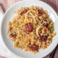 Sausage Fried Rice · Fried rice with Chinese sausage, green onions, carrots, green peas, onions, garlic, and eggs.