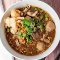 Boat Noodle · Spicy rice noodle soup with meatballs, sliced beef, bean sprouts, green onions, and broccoli.