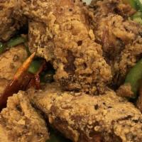 Salt & Pepper Chicken Wings · Hot and spicy. Fried chicken wings bed of cabbage, hot chili, jalapeno, bell pepper, and gar...