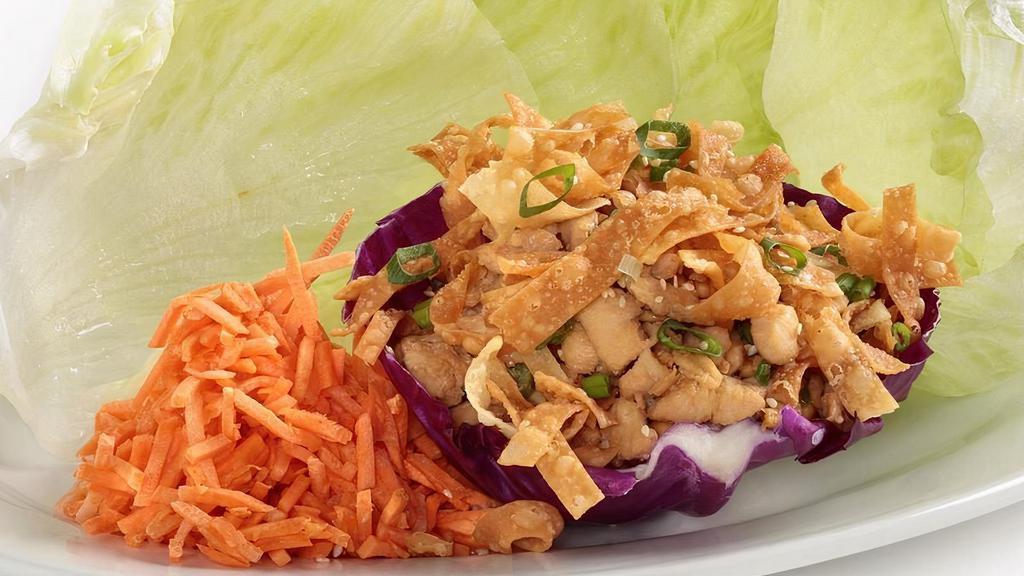 Lettuce Wraps · Marinated diced chicken breast, Julienne carrots, green onion, cashews and wonton strips. Served with iceberg lettuce cups, our own sesame soy sauce and spicy mustard for dipping.