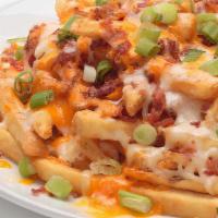 Loaded Fries  · Our seasoned fries loaded with melted Mozzarella and Cheddar, crispy bacon and fresh green o...