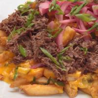 Short Rib Poutine · Our seasoned fries, topped with homemade jalapeño cheese sauce, braised short rib, beer gra...