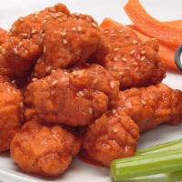 Boneless Wings · All white meat boneless wings tossed in one of our signature sauces, sprinkled with toasted ...