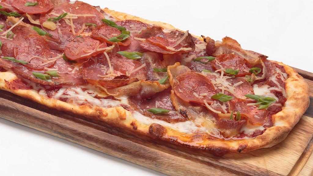 Charcuterie Flatbread · Our homemade pizza sauce, topped with Mozzarella cheese, Genoa salami, pancetta, pepperoni, and soppressata. Finished with Parmesan cheese and green onions.
