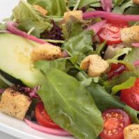 Oggi’S Garden Salad · Spring mix blend topped with fresh cucumber, pickled  red onions, cherry tomatoes and homema...