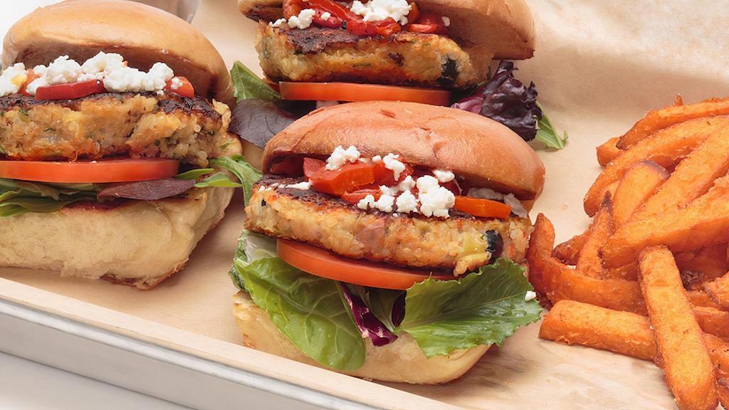 Quinoa Sliders · Vegetarian quinoa and black bean sliders, topped with Feta cheese, roasted red peppers, and roasted shallot Greek yogurt aioli.  Served with a side of sweet potato fries, spring mix blend, and tomato.