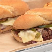 Philly Cheesesteak Sandwich · Layers of thinly sliced steak, grilled with red onions, green bell peppers and American Swis...