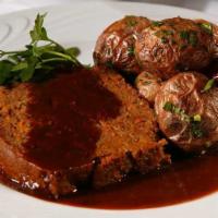 Smitty'S Famous Meatloaf · Mashed potatoes, gravy, roasted tomato relish