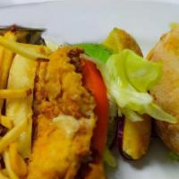 Cajun Fried Chicken Sandwich · Avocado, white cheddar, spicy aioli tomato, dill pickles, red onions
