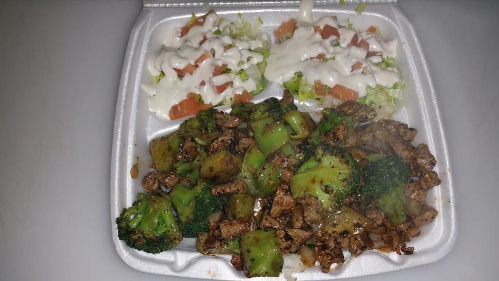 Broccoli Beef Rice Plate · BEEF AND BROCCOLI  OVER WHITE RICE AND A SALAD.