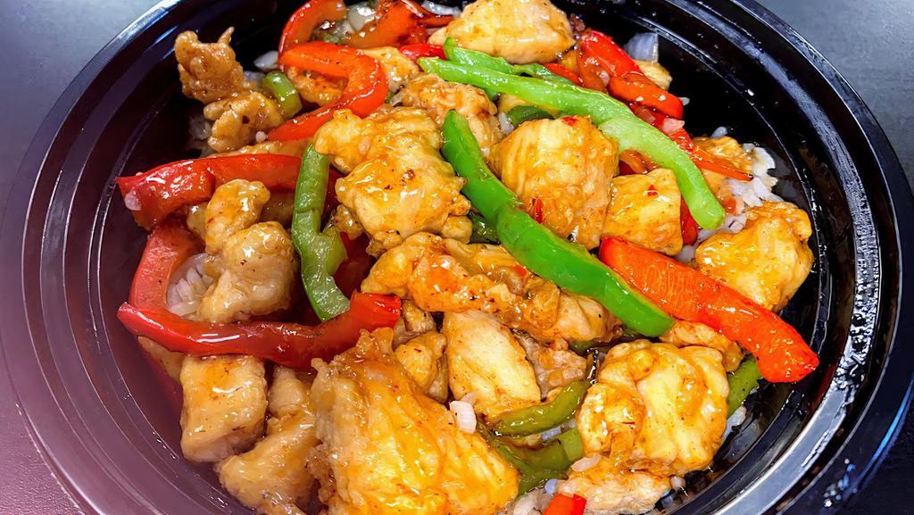 Pepper Sweet & Sour Chicken · Marinated chicken bite sautéed in bell peppers & onions and sweet & sour sauce over white rice.