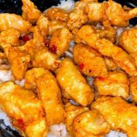 Sweet & Sour Chicken · Chicken bites  marinated in sweet & sour sauce over white rice.