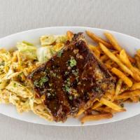 Baby'S Got Back Ribs - Half Rack · slow-cooked pork ribs, carolina gold bbq sauce, served with fries and lone star slaw.