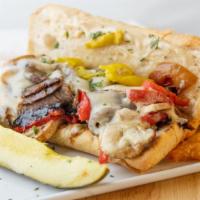 The Grilly Philly · grilled tri-tip, caramelized onions, roasted red peppers, mushrooms, pepperoncini, provolone...
