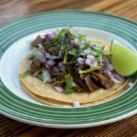 Asada Taco · vegan beef taco topped with onions and cilantro