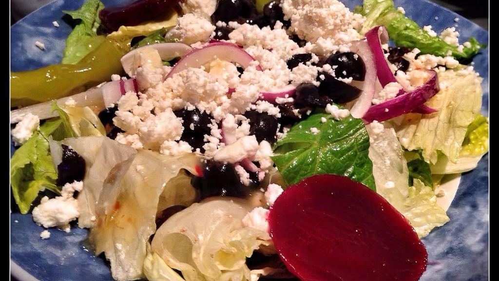 Personal Dinner Salad · Mixed greens, black olives, red onions, cucumber slices, fresh tomatoes, cheese blend, and croutons.