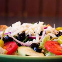 Dinner Salad · Mixed greens, black olives, red onions, cucumber slices, fresh tomatoes, cheese blend, and c...