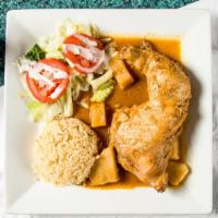 Pollo Guisado · Stewed chicken with potatoes. Served with rice and tortillas.