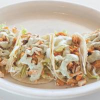 Chicken Tacos (4Ct) · Shredded lettuce, grilled chicken breast,  pico de gallo,  house cilantro dressing.