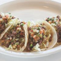 Beef Tacos (4Ct) · Shredded lettuce, ground beef,  pico de gallo,  house cilantro dressing.