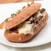 So-Cal Cheesesteak · Grilled sirloin steak sautéed in garlic, thyme, and butter, topped with homemade tomato reli...