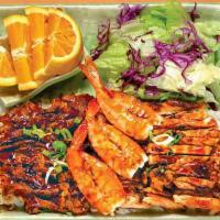 Yamas Plate · Bed of white rice, teriyaki beef and chicken, three grilled shrimp, small salad (oriental dr...