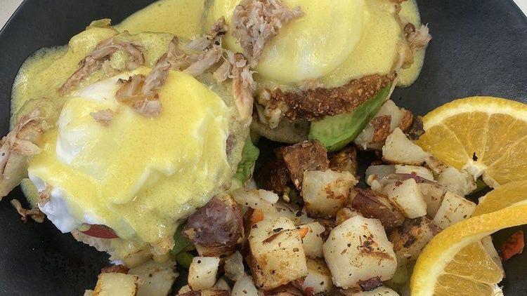 California Benedict · Two poached eggs, a toasted English muffin, four strips of bacon, tomatoes, and avocado. Topped with our homemade hollandaise sauce.