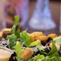 Caesar Salad · Grilled chicken, crisp romaine, parmesan cheese, and croutons. Served with Caesar dressing. ...