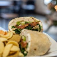 Southwest Chicken Wrap · Whole wheat tortilla stuffed with grilled chicken, black beans, tortilla strips, pepper jack...