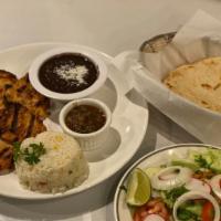 Pollo Asado · Boneless chicken steak marinated and grilled. Served with rice, beans, corn, small salad, co...