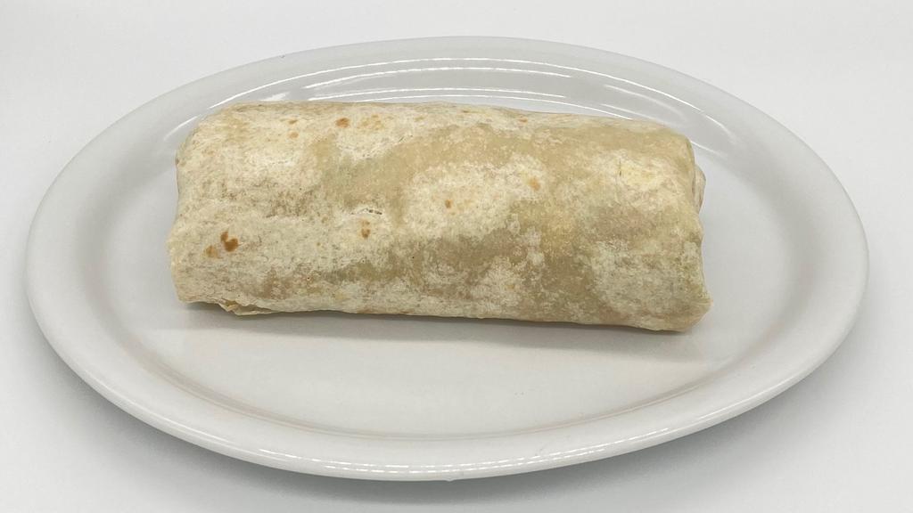 Regular Burrito (Dry) · Asada, carnitas, pastor or grilled chicken a flour tortilla filled with beans, rice, cheese, onions, cilantro, and salsa.
