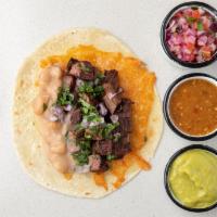 Sonorita Taco · Flour tortilla, angus steak (100% certified angus beef), beans, cheese, cilantro, onions, gu...