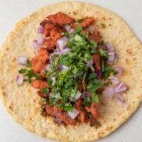 Al Pastor Taco · Handmade corn tortilla, rotisserie marinated pork, cilantro, onions, guacamole & chipotle sa...
