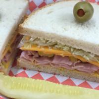 Tim Allen · Stacked metro Deli ham on sourdough with pepper rings, mayo, mustard, lettuce, & thickly cut...