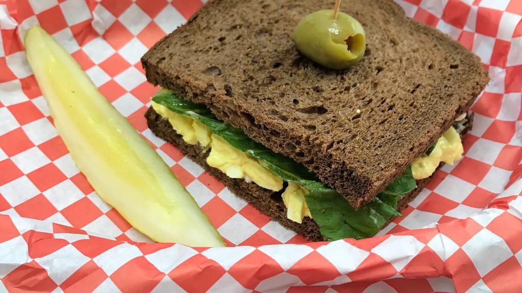 Bill Gates · Why mess with perfection? Egg salad sandwich made with fresh farm eggs, mayo & romaine lettuce on dark sweet wheat.