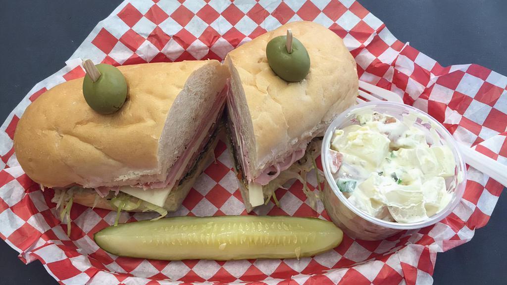 The Brummer · Our twist on an Italian sub. Lettuce, Italian Dressing, in-house olive salad, salami, Jack & ham on a soft roll.