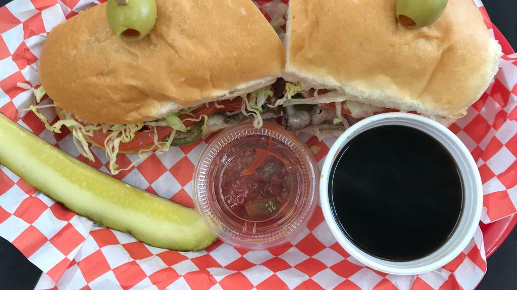 Jerry Lewis · Tender sliced roast beef with melted jack cheese, jalapeño rings, lettuce and tomato on a roll. Au jus and salsa on the side.