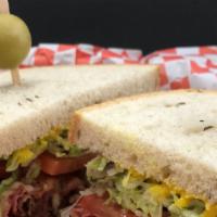 Laura · Thinly sliced hot pastrami smothered in melted pepper Jack, mild salsa, mustard, lettuce & t...