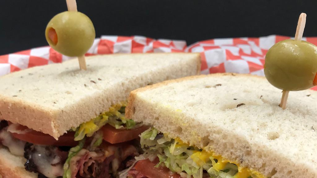 Laura · Thinly sliced hot pastrami smothered in melted pepper Jack, mild salsa, mustard, lettuce & tomato on rye.