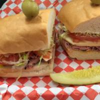 Rocky Balboa · Tender peppered roast beef stacked high on a soft roll with lettuce, tomato, mayo, mustard &...