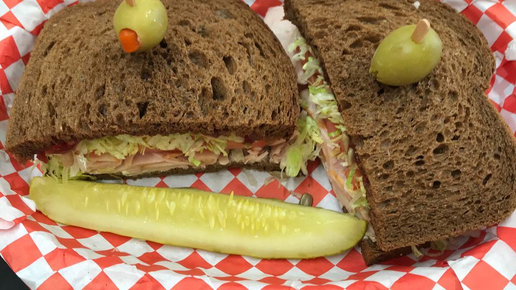 Tuesday-Pocahontas · Bring back the holidays with smoked turkey and cranberry sauce, topped with sunflower seeds on dark sweet wheat with lettuce, tomato and mayo.  Not available except on Tuesdays.