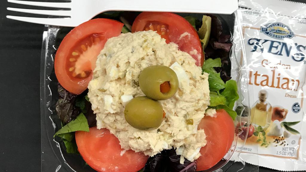 Tuna Cup · Tuna salad over mixed lettuce and topped with tomato & green olives. Served with dressing.