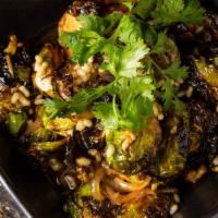 Charred Brussel Sprouts · Cilantro lime vinaigrette, puffed rice.
