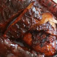Combo Plate · 1/4 of Baby Back Ribs , 1 pc BBQ or Fried Chicken , sliced Brisket , 1 Hot link , served 
wi...