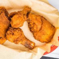 Fried Chicken (1/4) · Two pieces of chicken, white, or dark meat, served with two sides.