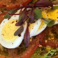 Avocado Toast · Smashed avocado, tomato and lemon pepper on toasted house baked rosemary bread.