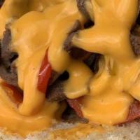 Philly · Thinly sliced ribeye, onions, bell peppers, Cheddar cheese sauce, 10